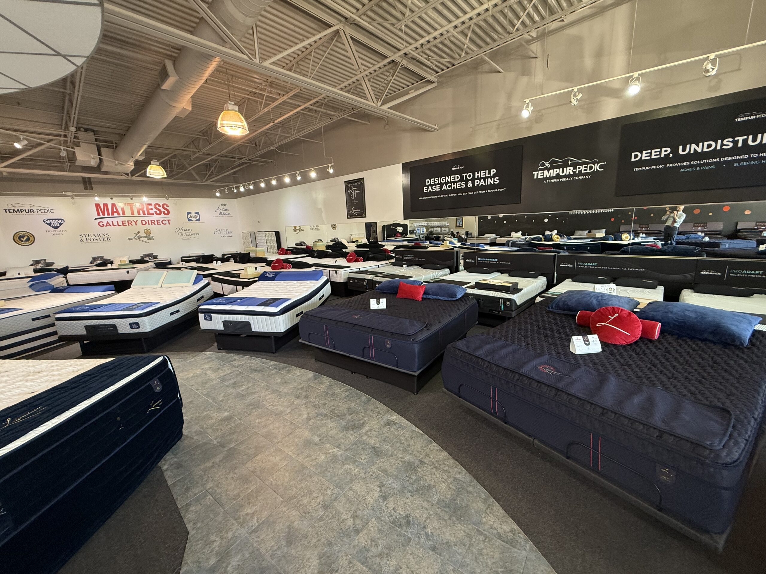 Best Hybrid Mattresses 2026 report display featuring Sealy 1881 Artisan Hybrid, Spring Air Copper Hybrid, Tempur-Pedic ProAdapt Hybrid, and Legendaire Contour Advanced Hybrid mattresses at Mattress Gallery Direct in Murfreesboro, Franklin, and Smyrna TN.